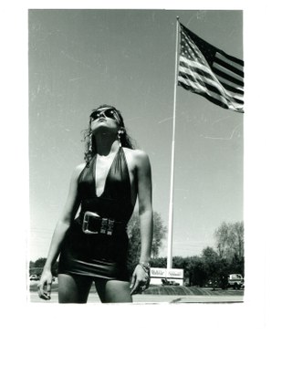 model brunette black dress with flag 1991